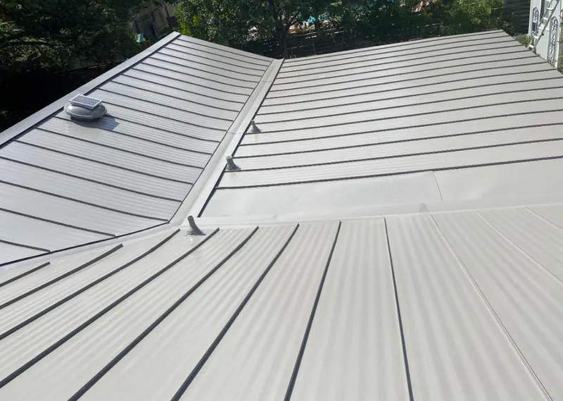 Solar attic fan installed on a metal roof for Roof Ventilation in Sarasota